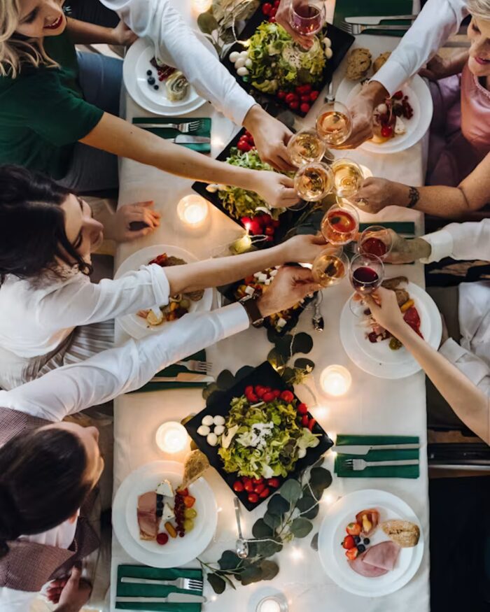 A toast around a candlelit table